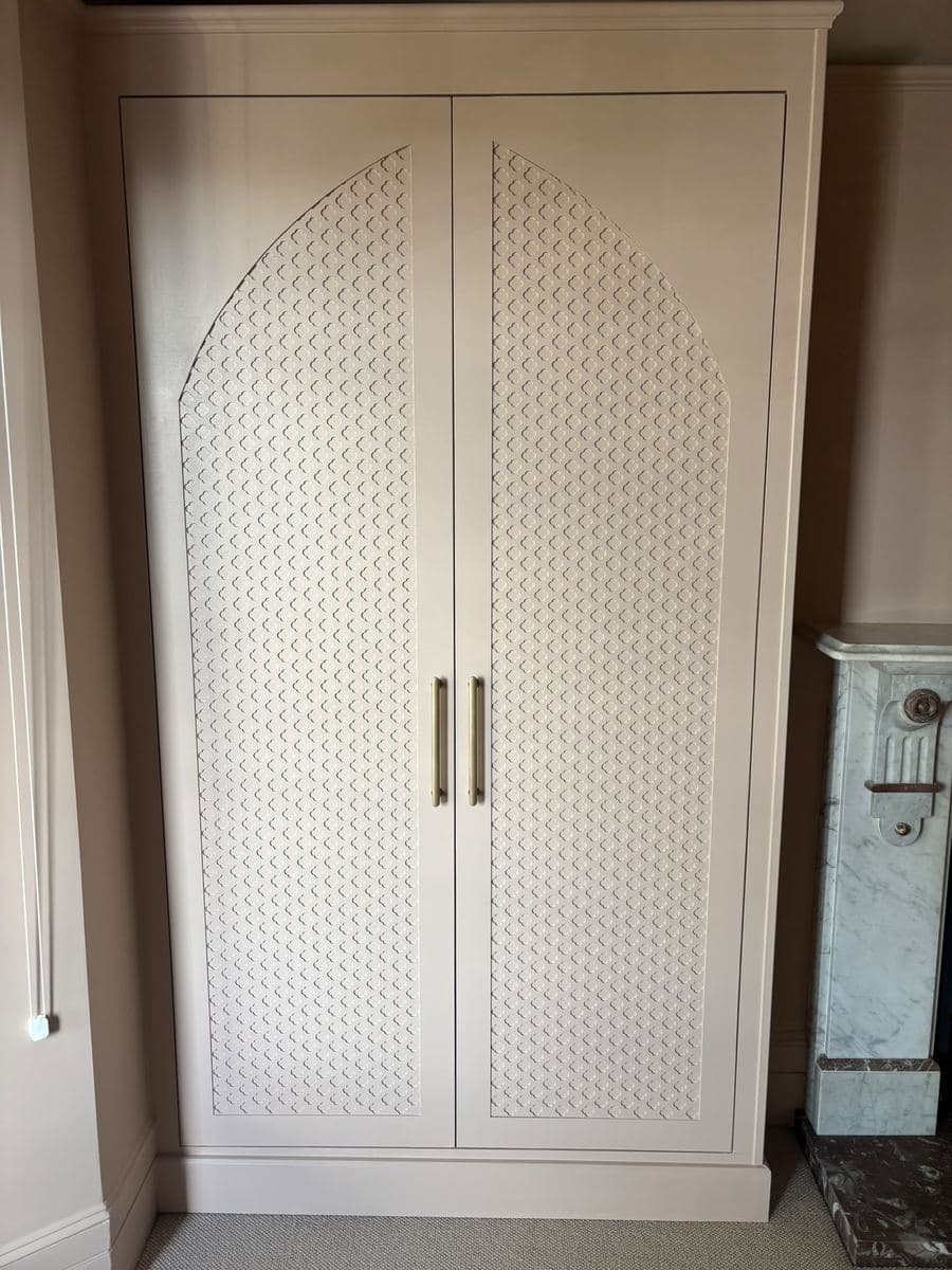 Wardrobe with a carved fretwork panel door