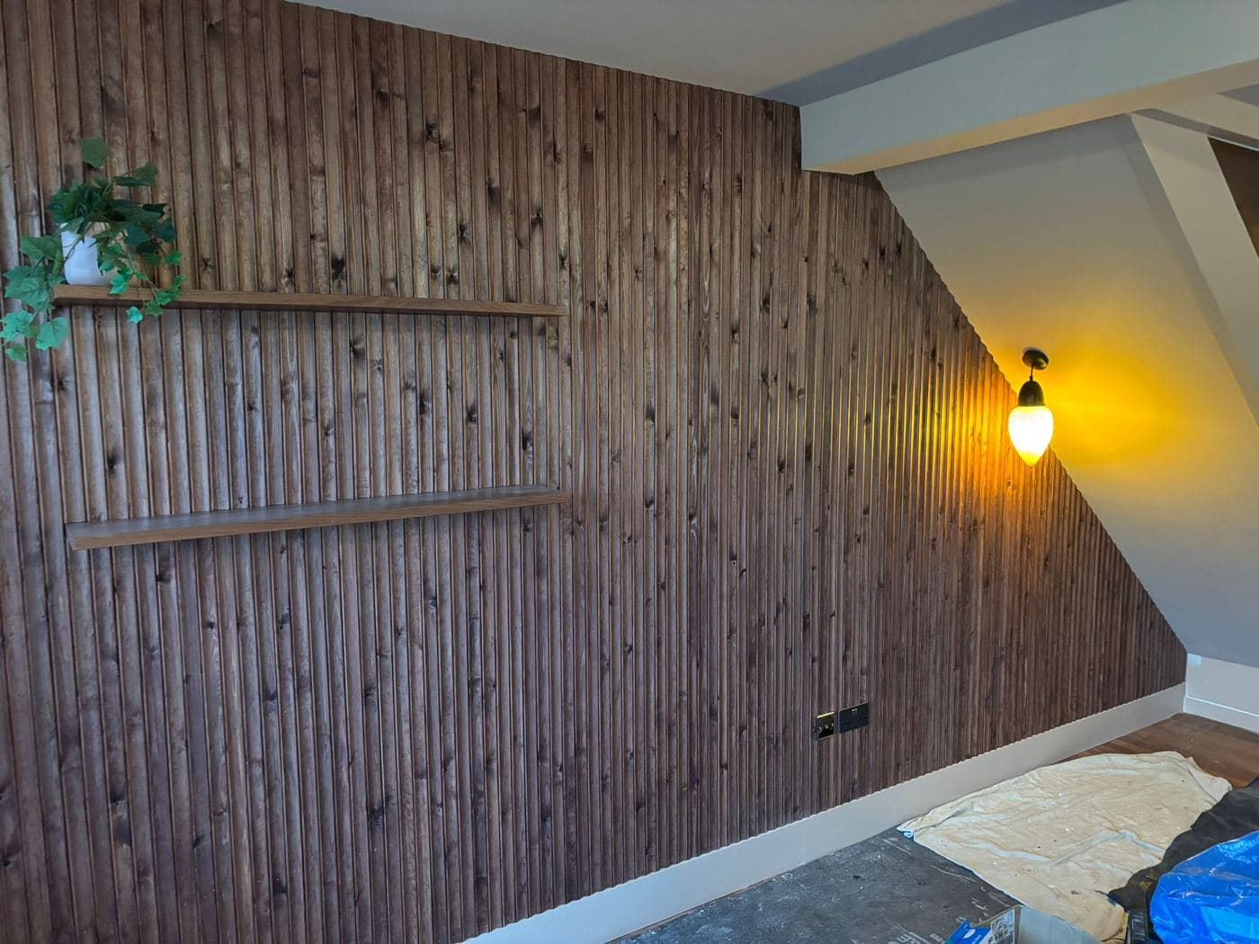 Timber slatted panelling with a fitted shelf