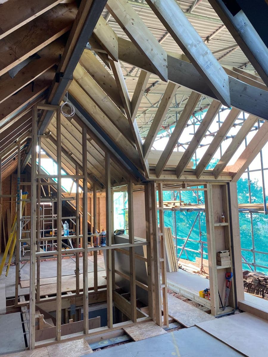 Roof structure with steel and timber, part way through the build