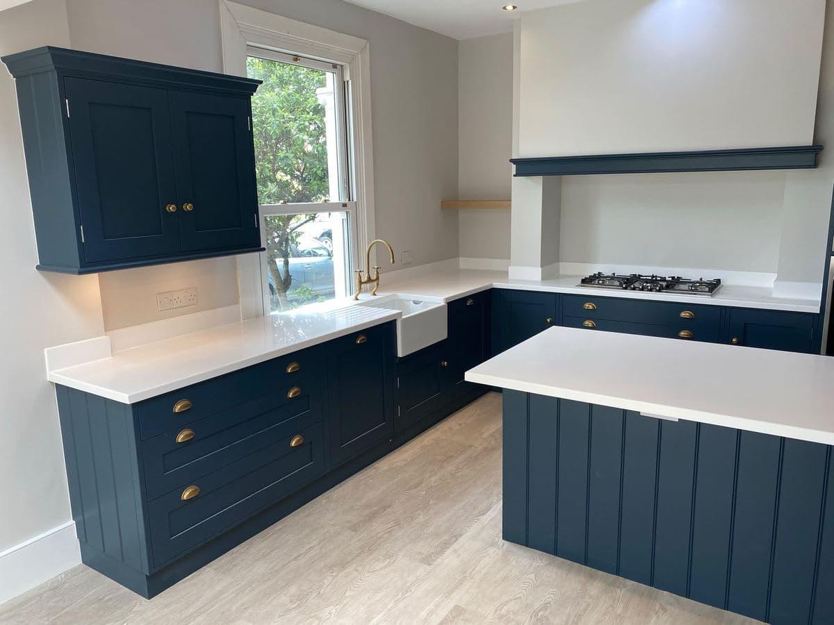 Navy shaker kitchen with brass hardware