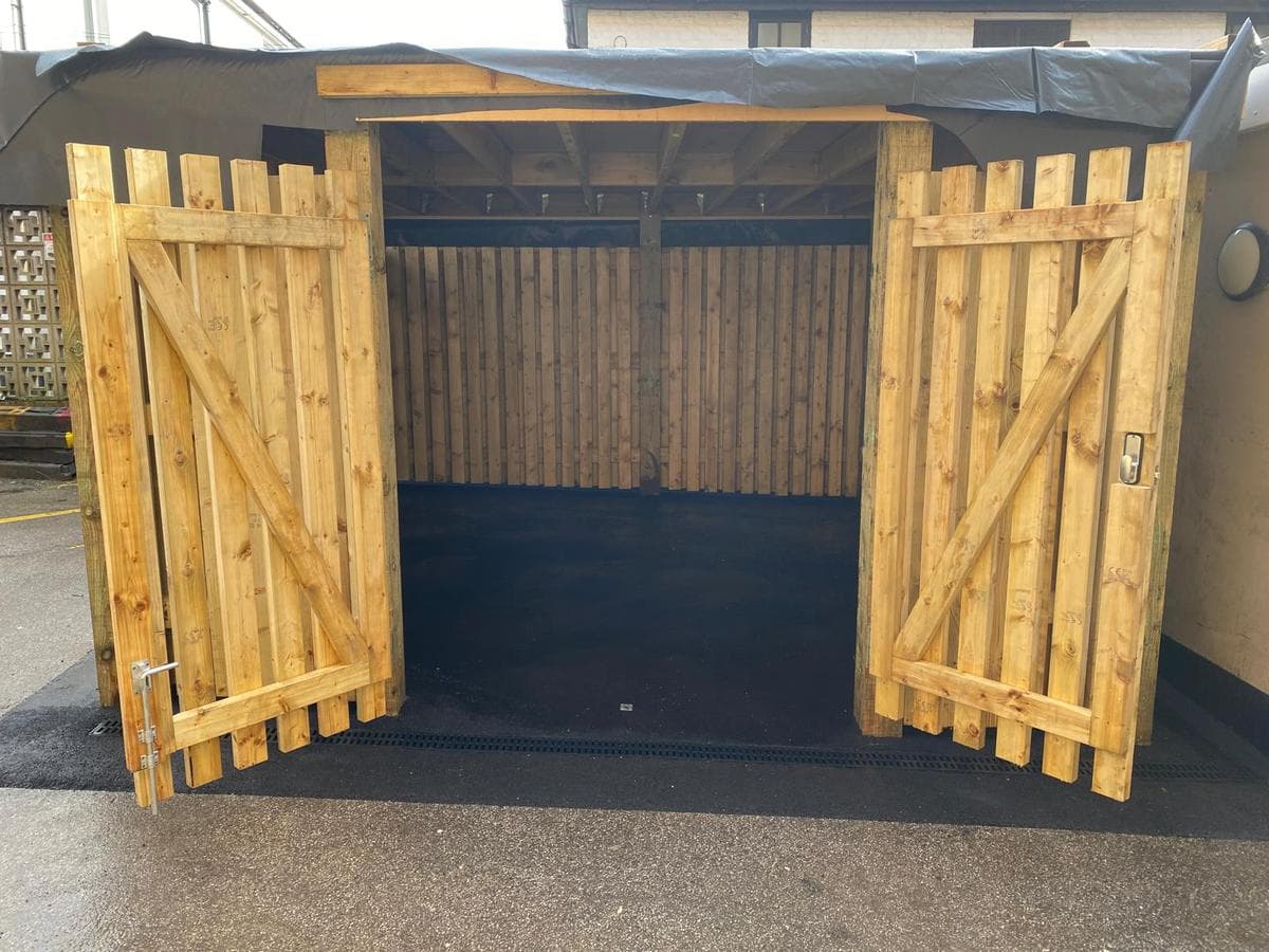 Timber store with gates open