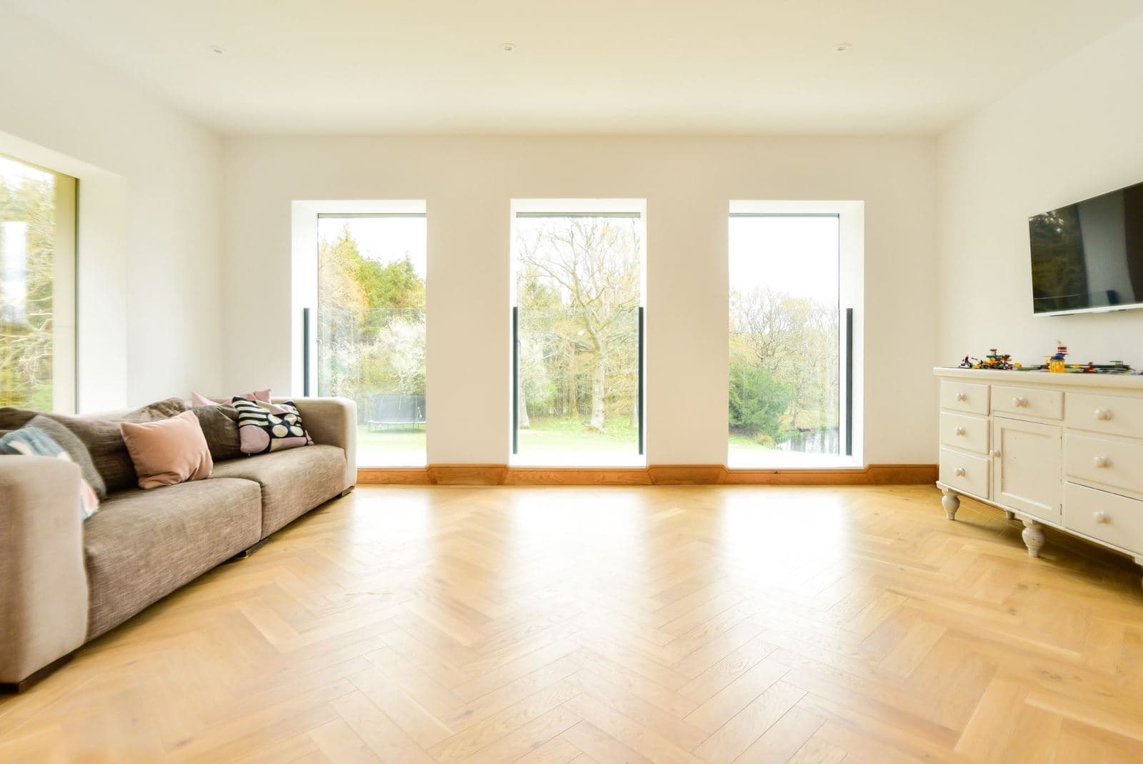 Finished living room with bifold doors onto the garden