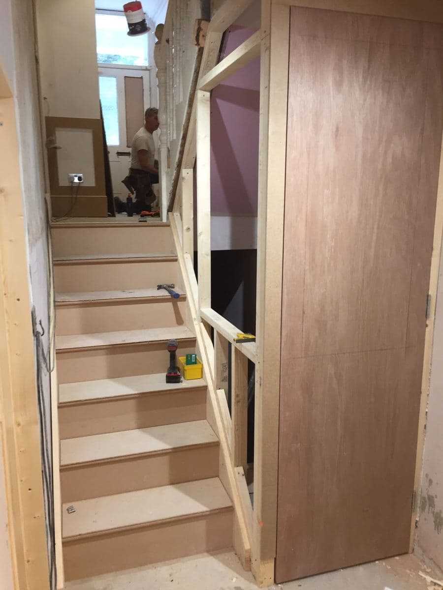 Understair storage fitted into a staircase