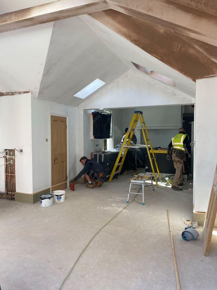 Kitchen mid fit beneath a vaulted skylight