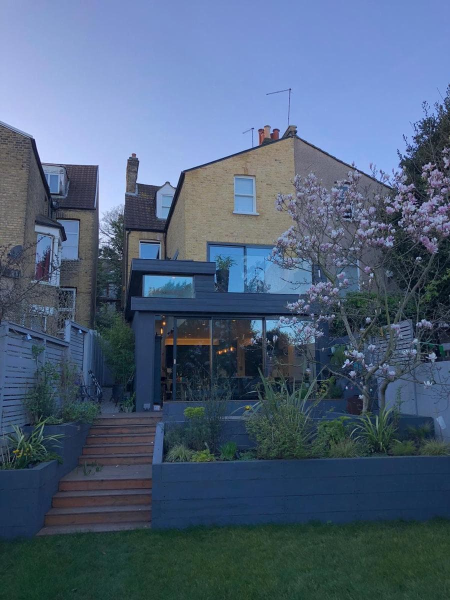 Rear extension at dusk, garden finished