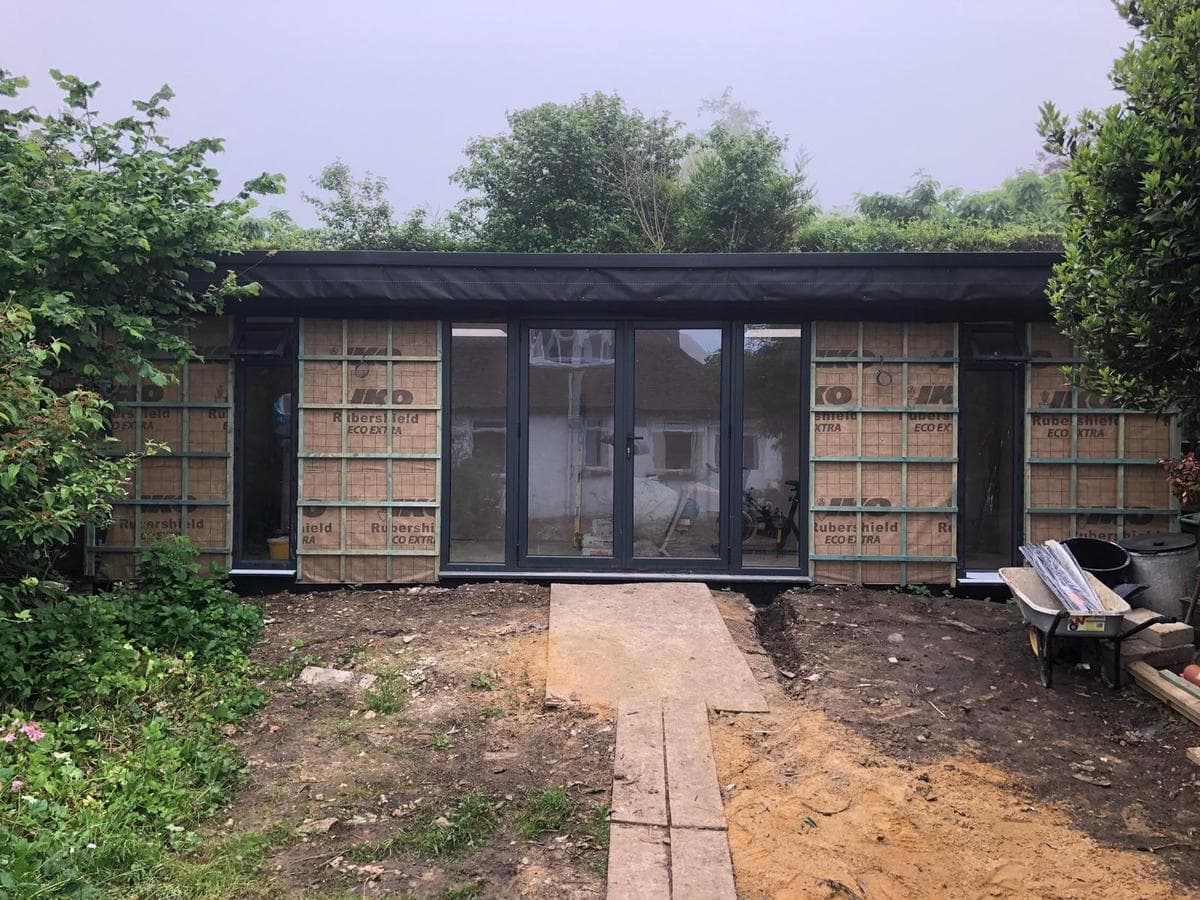 Garden room finished, dark clad with bifolds
