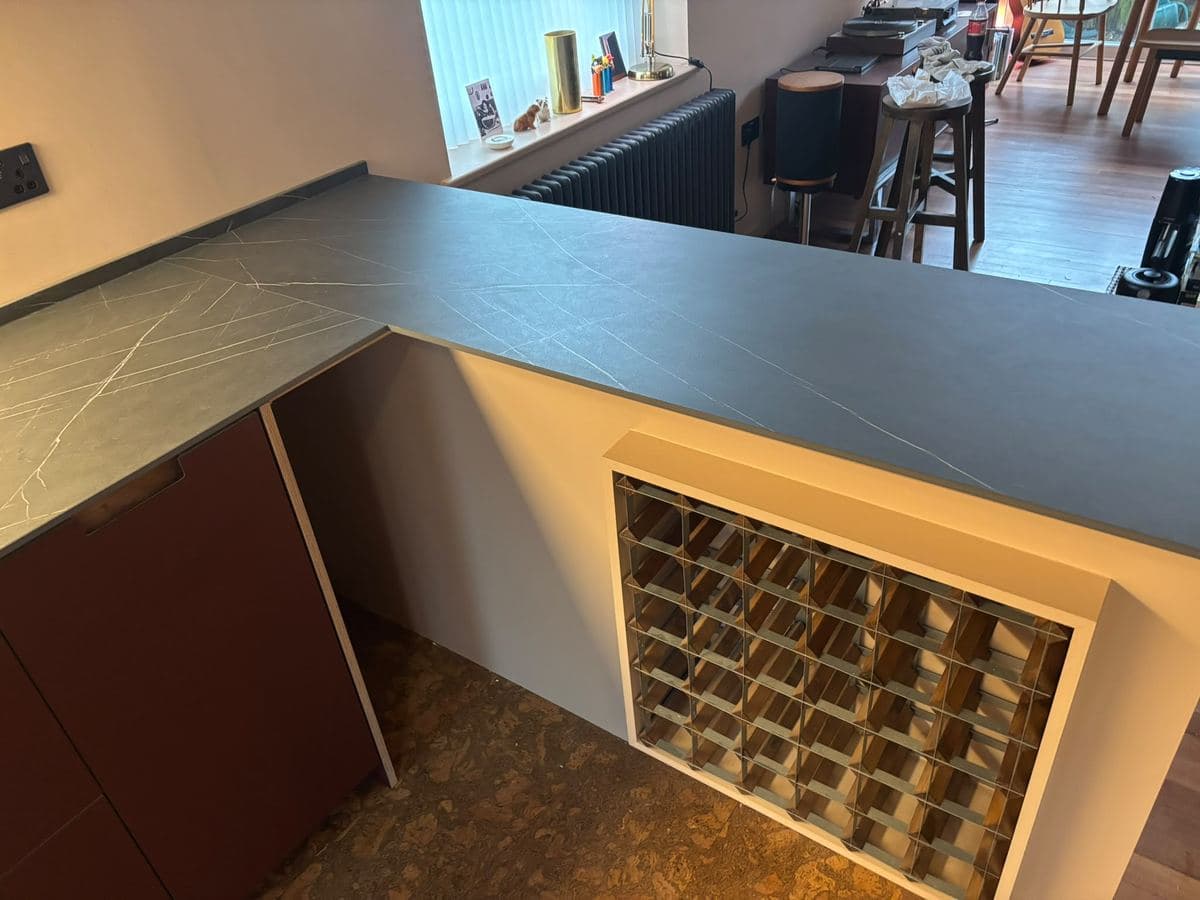 Fitted wine store beside a window seat