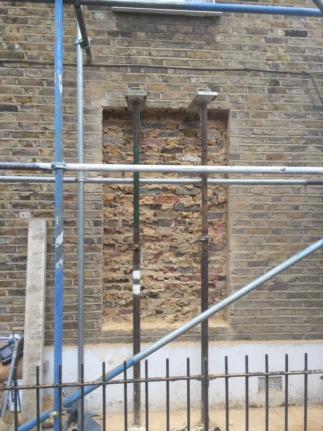 Brick opening being restored, scaffold in place