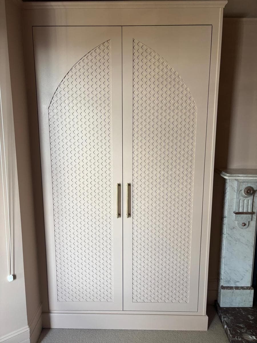 Wardrobe with fretwork panel