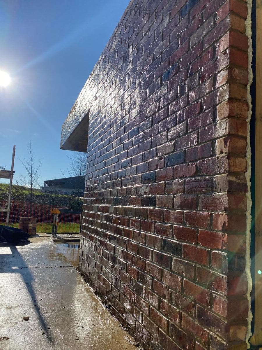 Cantilevered edge of the veranda above the brickwork