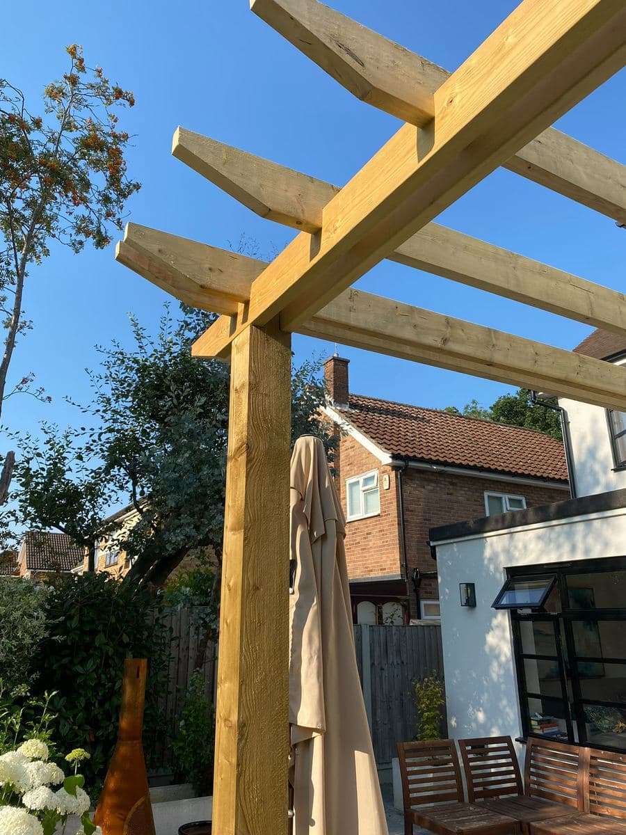Detail of a timber pergola joint over a patio