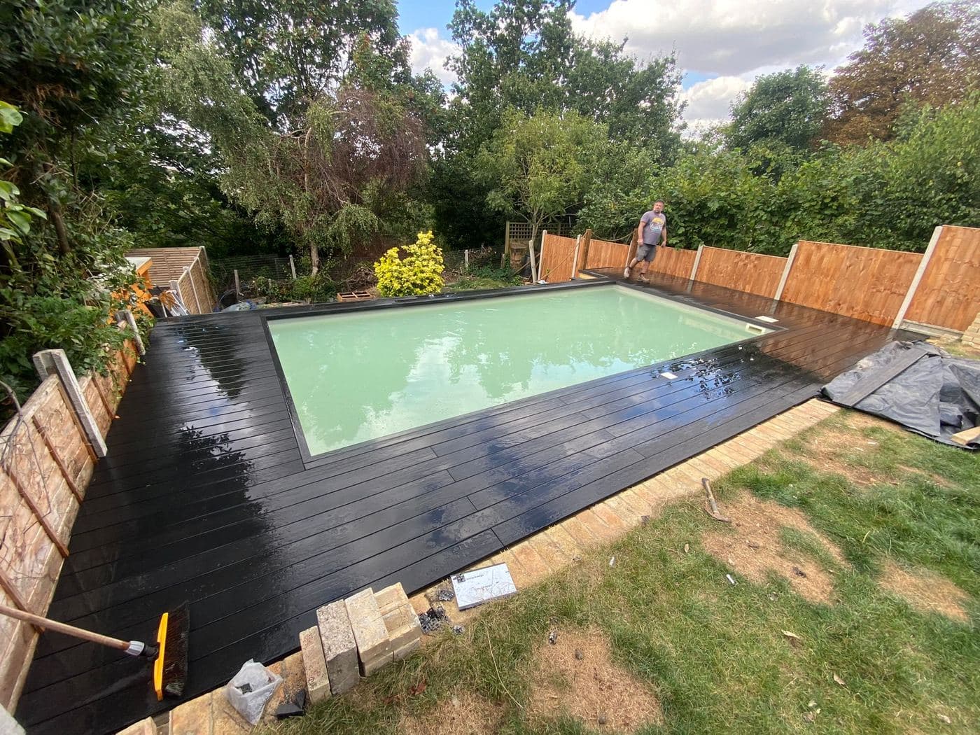 Composite decking built around an outdoor swimming pool