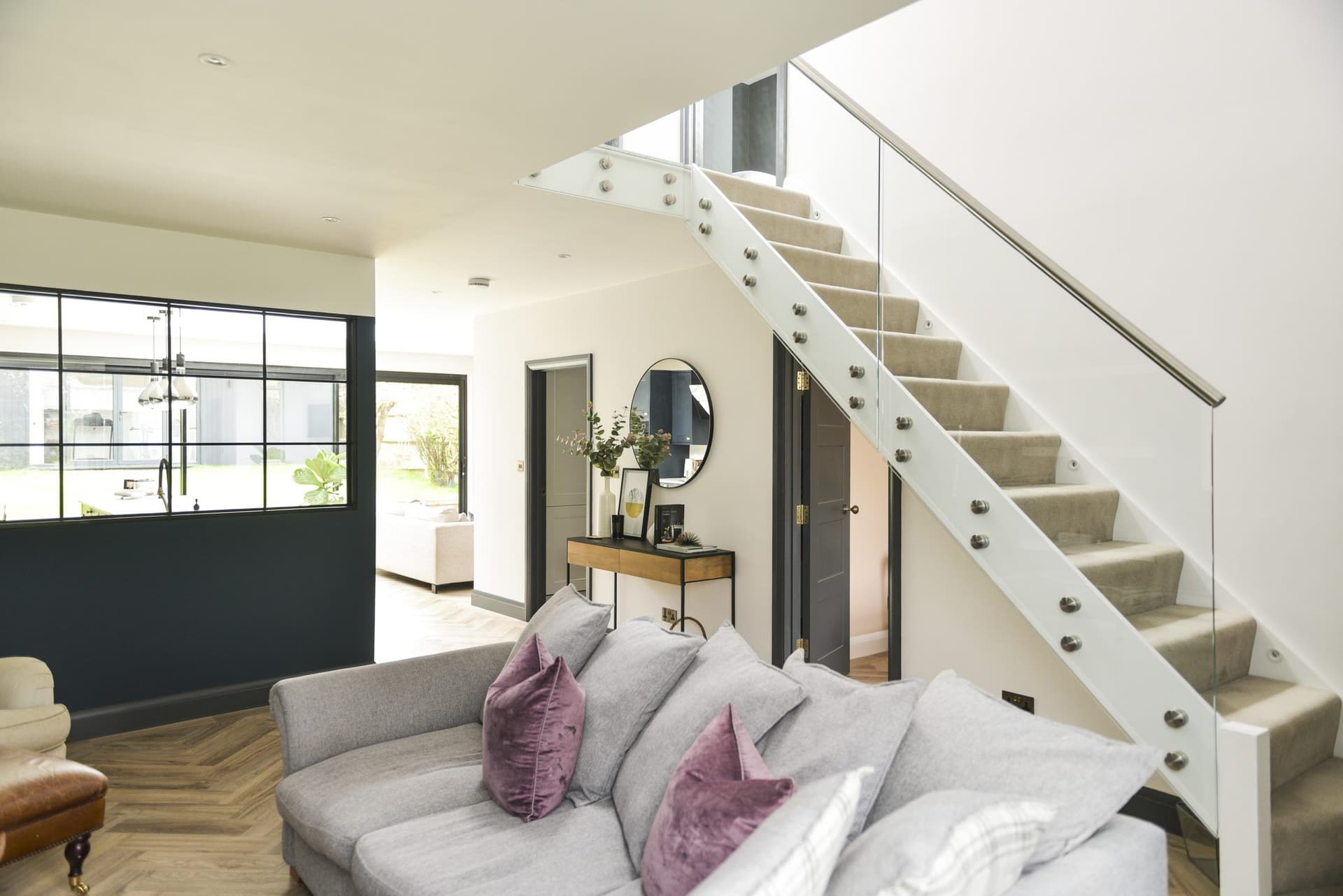 Staircase beside a steel framed internal screen
